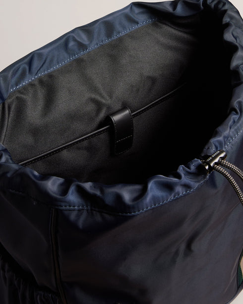 MATEW-Bags-The ultimate backpack for your on-the-go lifestyle, MATEW combines functionality with a bold, fashionable design. Featuring webbing details and side release buckles, this backpack is made to last. The top handle and adjustable shoulder straps make it easy to carry and the elasticated side pocket adds an extra level of convenience. A silicone logo patch finishes the look. The shell fabric of this product is made of 100% recycled polyester. Using recycled polyester helps divert plastic waste from e